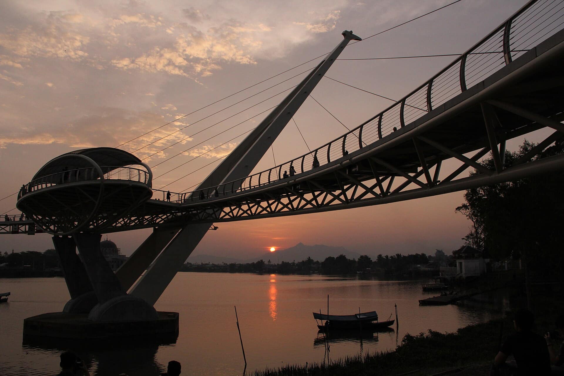 The Darul Hana bridge silhouetted against sunset on the Sarawak River