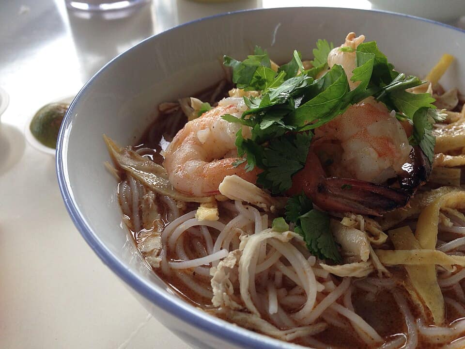 A bowl of Sarawak laksa with prawns, shredded omelette and vermicelli