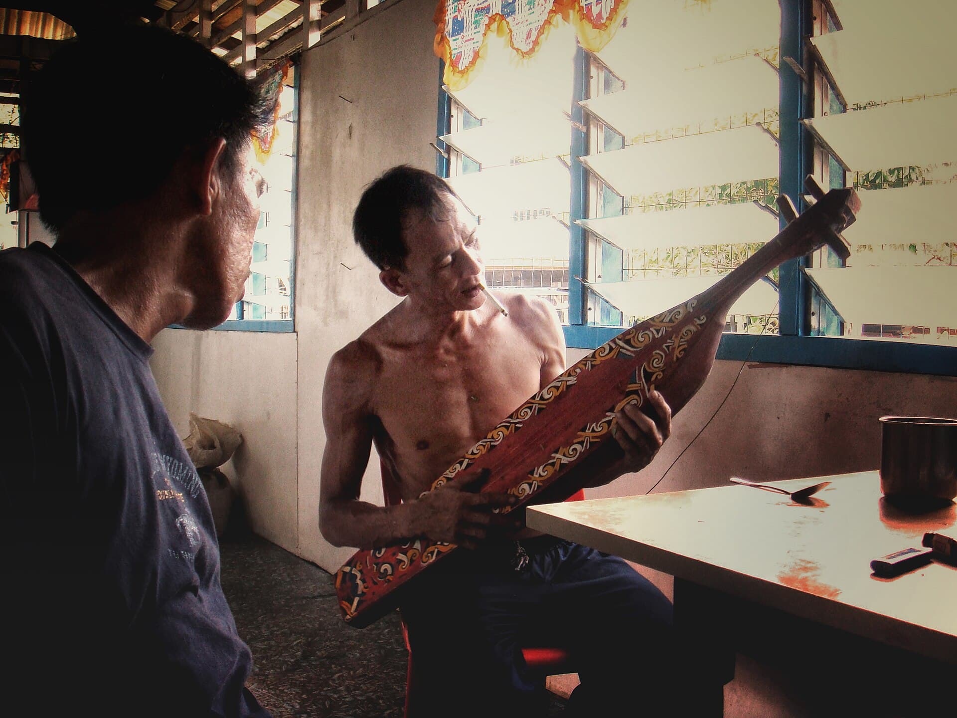 A Kayan musician playing the sape in Sarawak