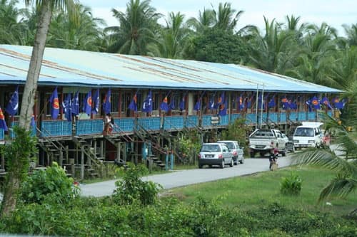 Iban longhouses on stilts beside the river at Bintulu