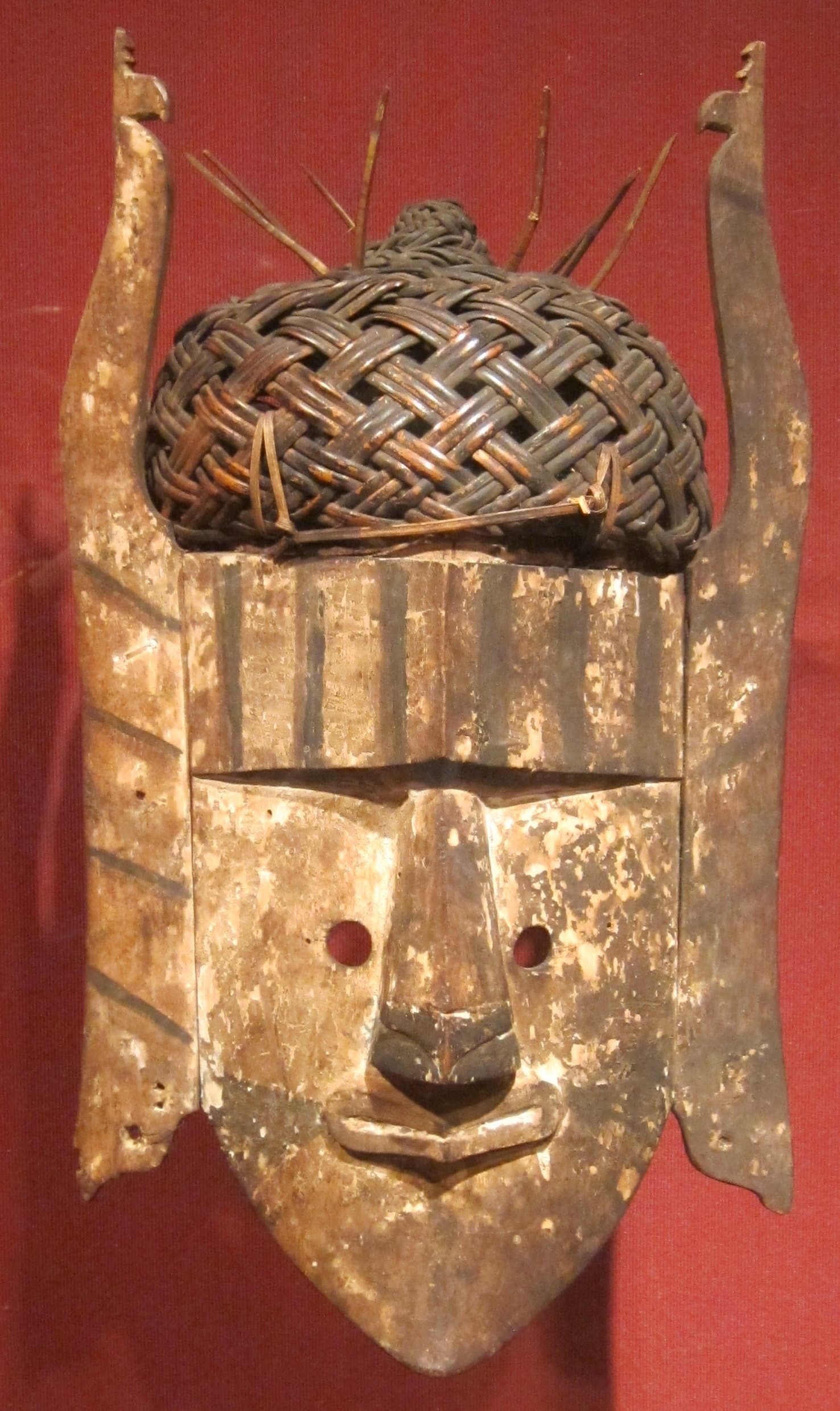 Anthropomorphic mask with basketry cap, Borneo, Kalimantan, Kenyah-Kayan, 19th century, wood, rattan, polychrome, Honolulu Museum of Art , accession 10197.1