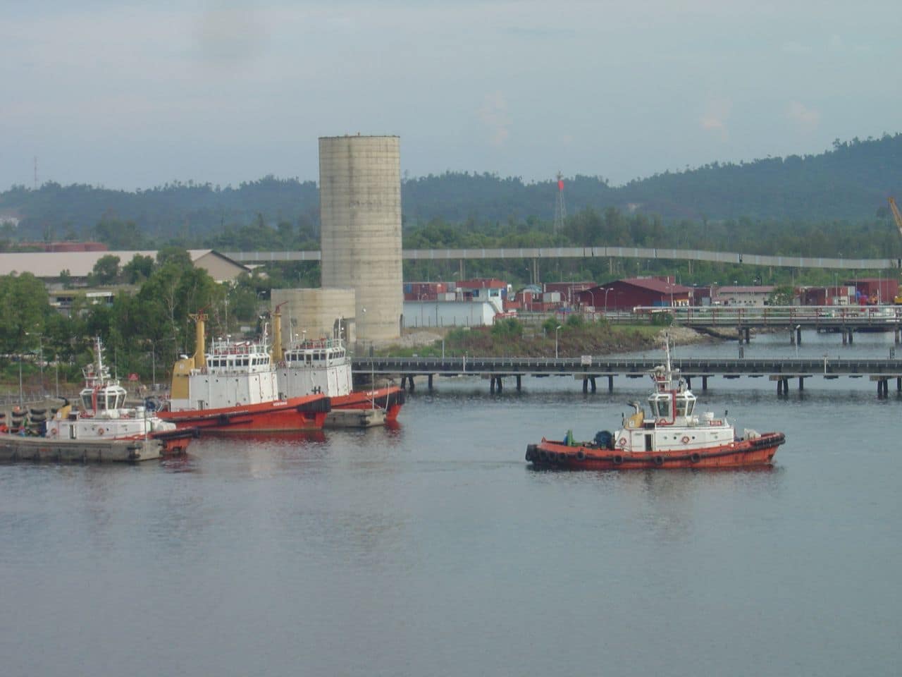 The following is the author's description of the photograph quoted directly from the photograph's Flickr page. "Bintulu Port patrol boats and tug boats at the Marine Berth. Aug 19, 2007. Taken from top of yard RTG, BICT, Bintulu, Sarawak, East Malaysia rwsphoto.blogspot.com "
