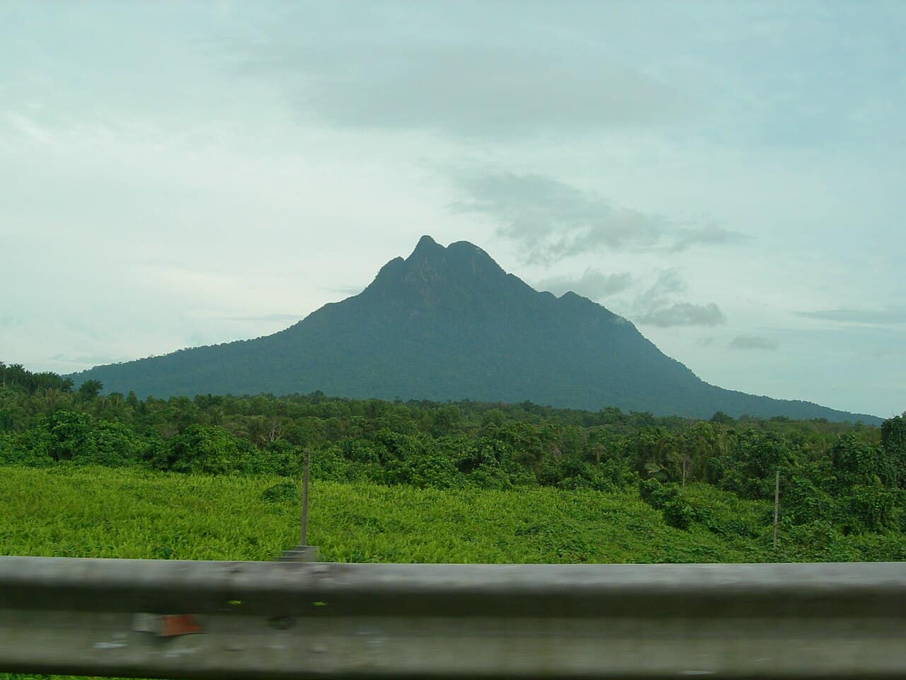 Mount Santubong rising above the river, seen from Santubong Bridge