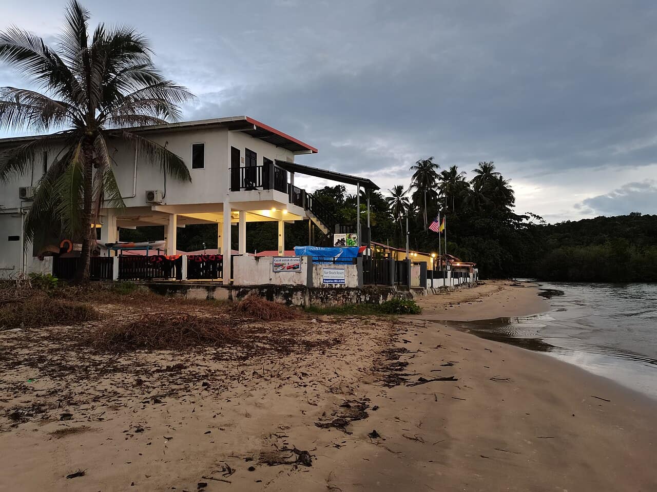 Beachfront chalets under the trees at Siar Beach