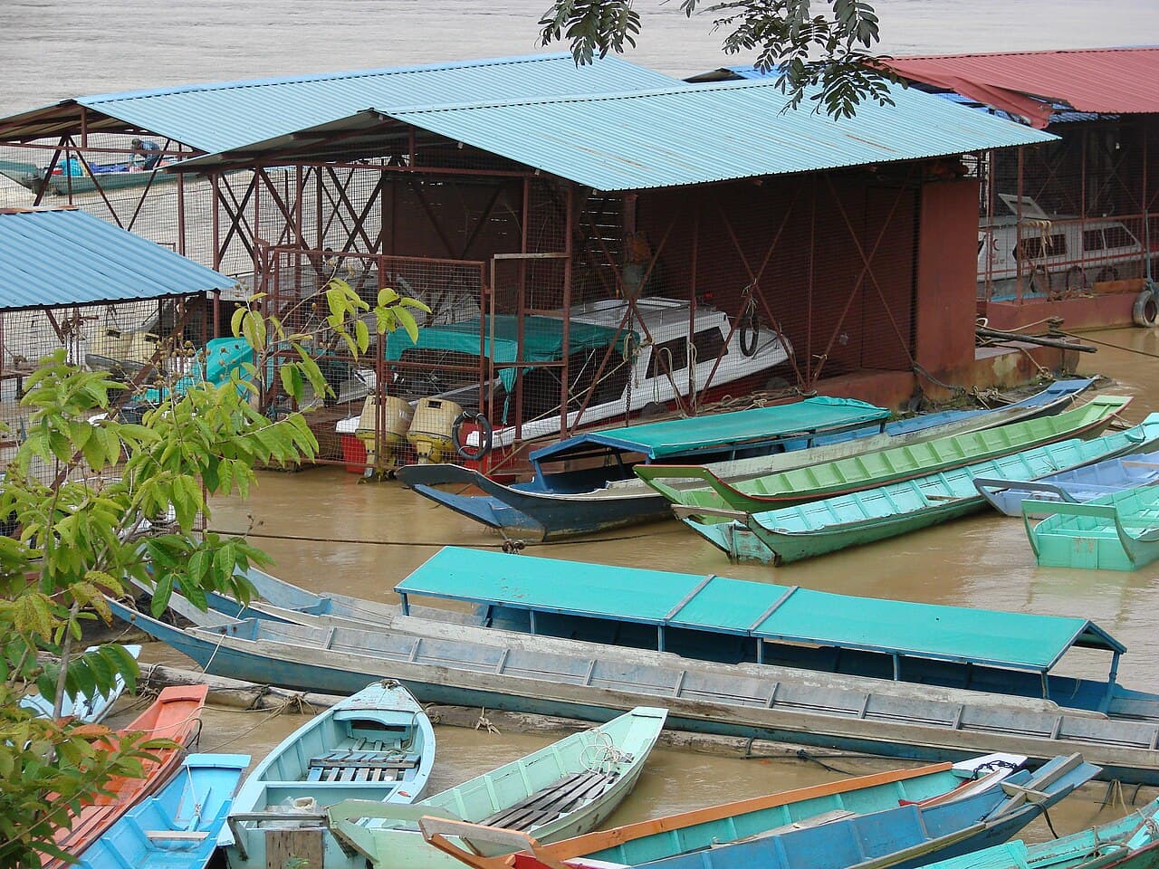 Speedboats and longboats crowding the wharf at Kapit on the upper Rejang