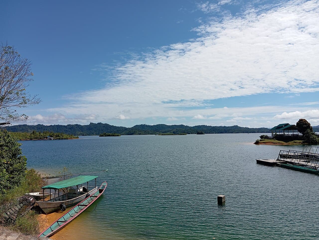 The still waters of the Batang Ai reservoir ringed by rainforest