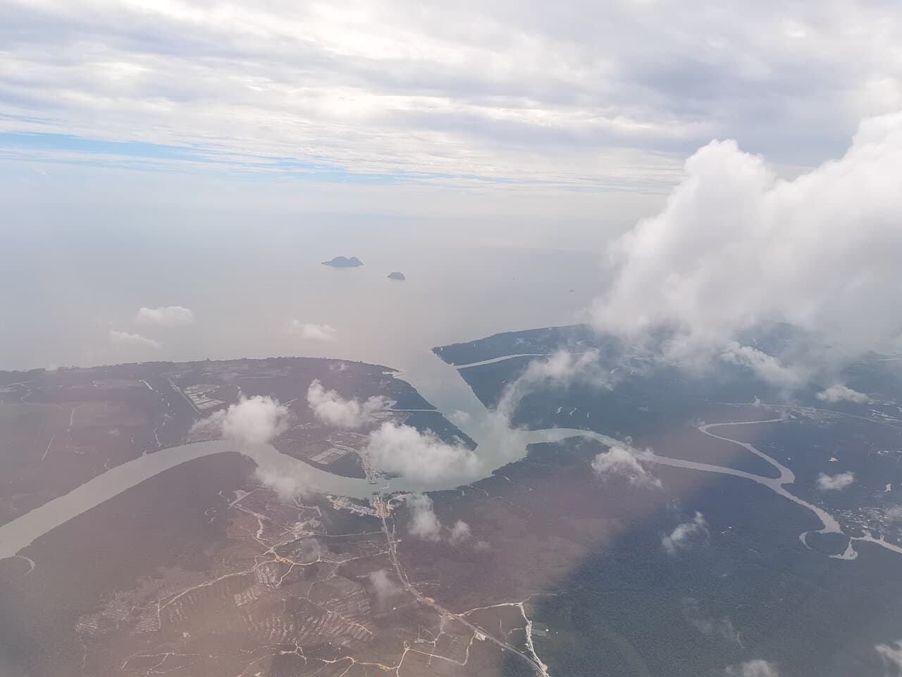 Satang Besar and Satang Kecil islands lying off the coast beyond the mouth of the Rambungan River