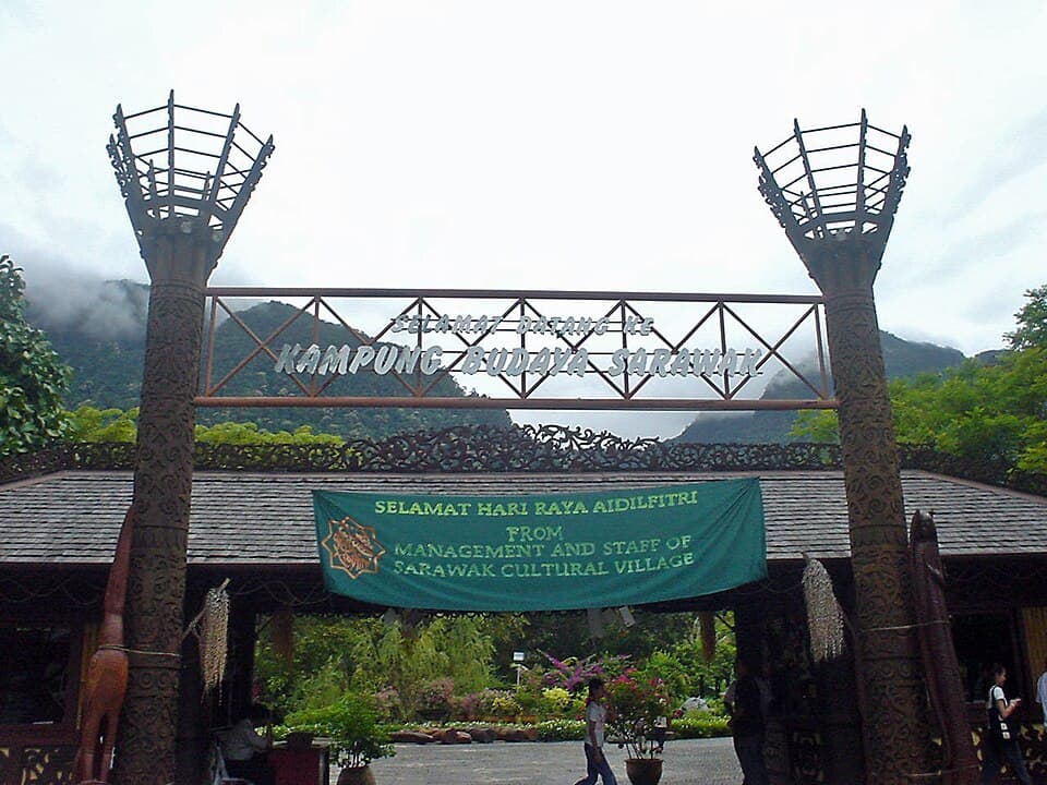 Traditional ethnic houses set among palms at the Sarawak Cultural Village