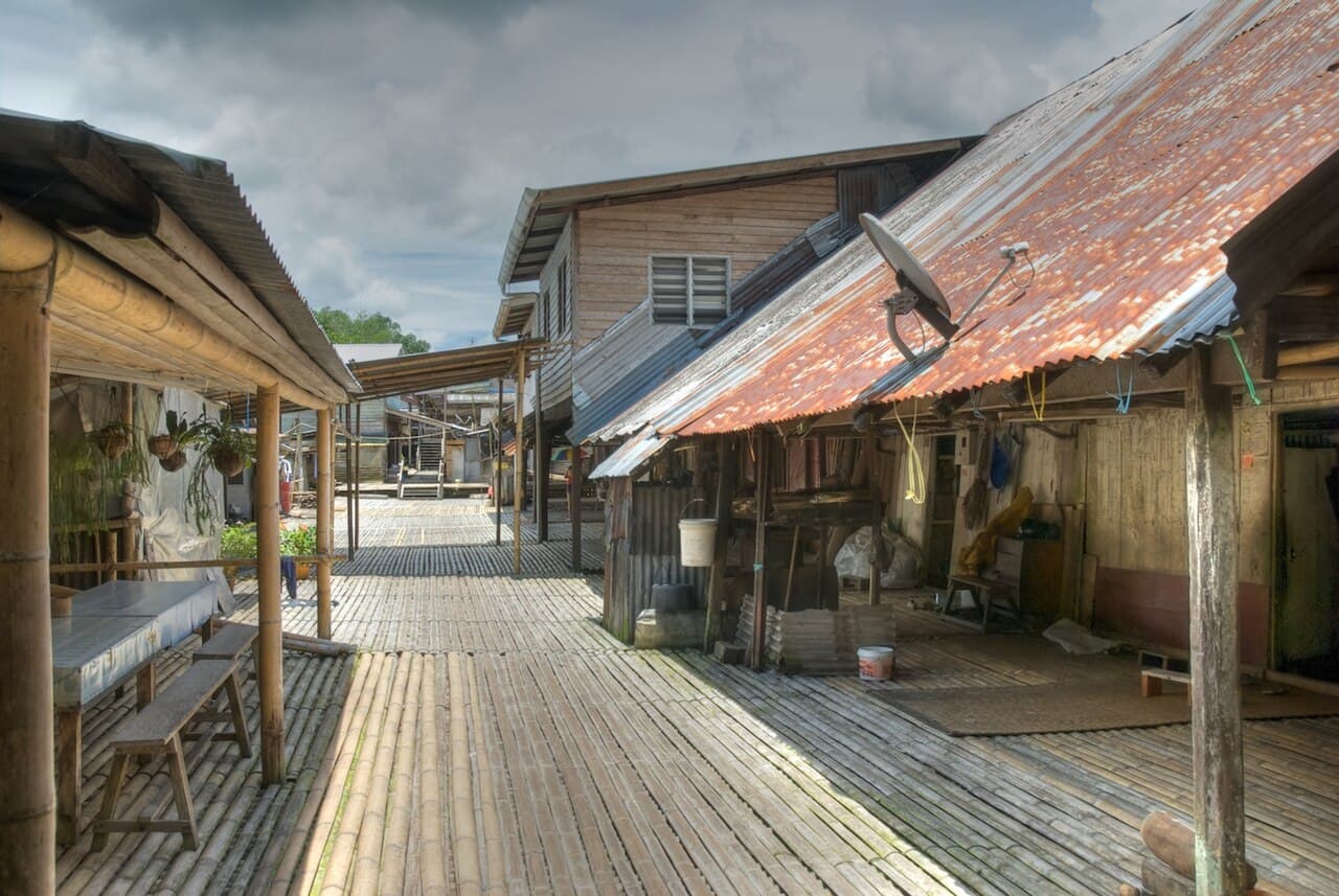 The bamboo-floored walkway of Annah Rais longhouse, houses on either side