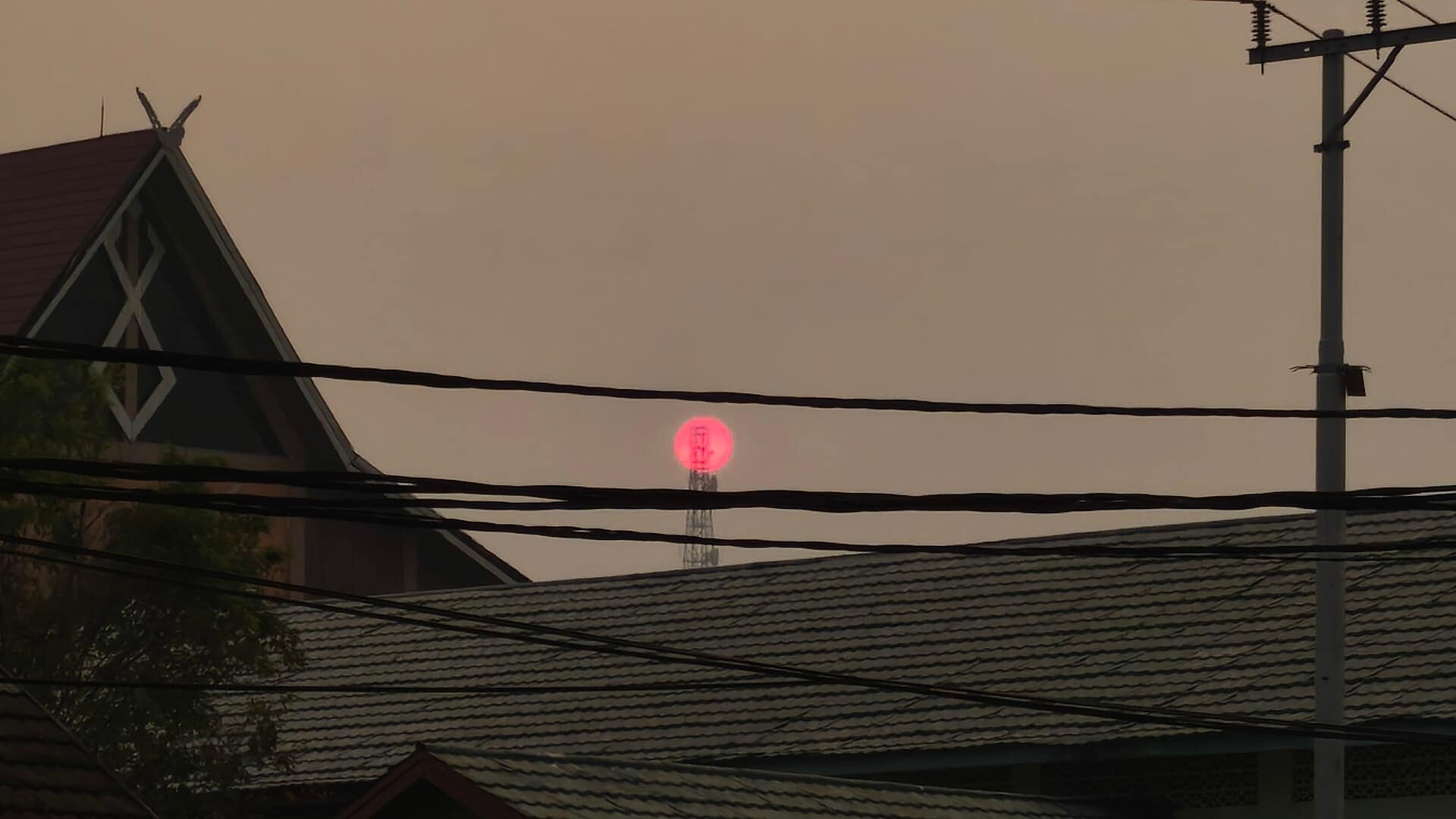 Thick smoke haze obscures the sky above a residential area in Kalimantan, Indonesia, in August 2026.